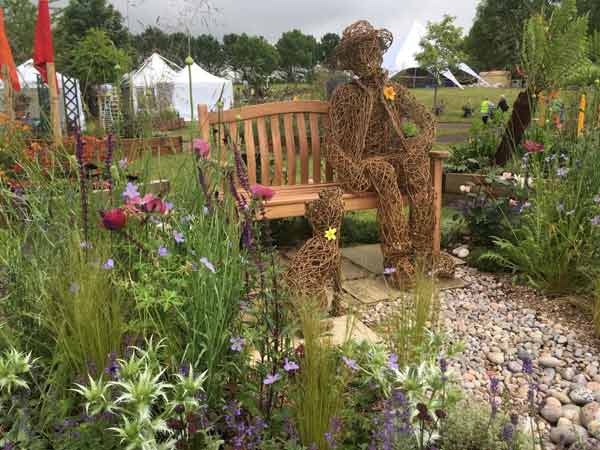 Caroline&rsquo;s sculptures in their Gold Medal Winning Garden.