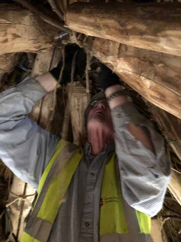 As Gordon is demonstrating, this thatching work is not all glamour.