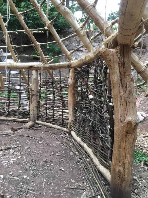 Another view of our partially completed wattle walls. Question: should there be windows?